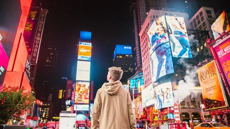 boy-looking-up-at-ads-billboards