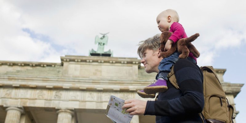 a man and his baby are visiting US historic monuments