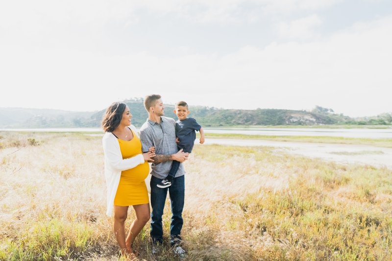 family traveling in a wheat field