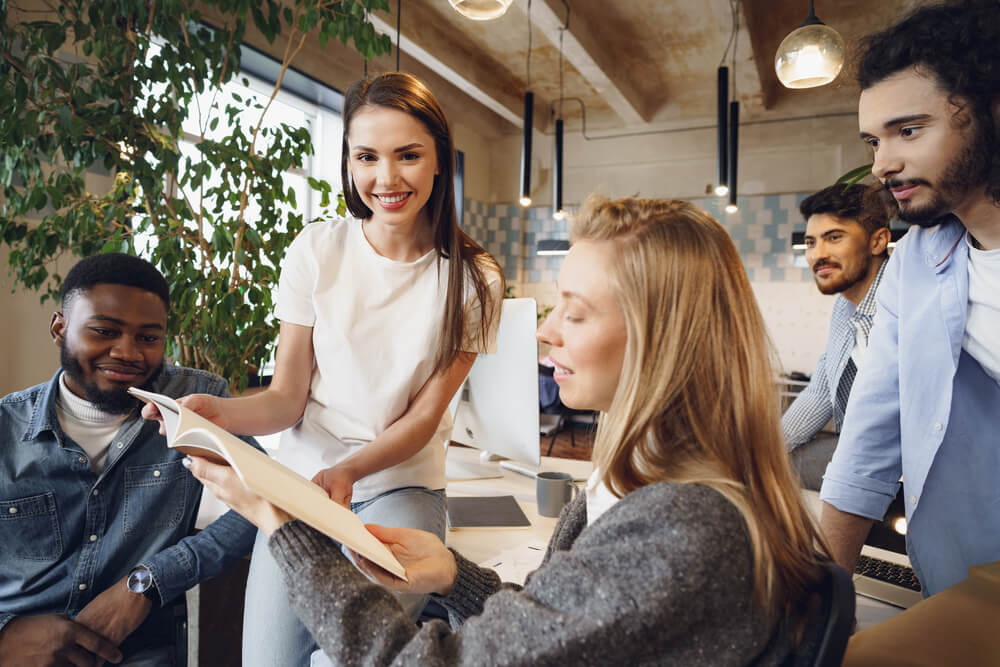 a group of paid advertising experts in an advertising agency, sitting around a table